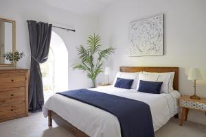 a bedroom with a large bed and a window at No 5 Old Church in Ventnor