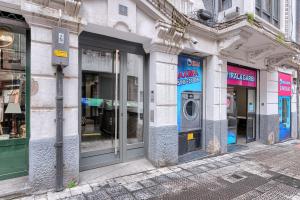 a row of store fronts on a city street at Vivienda Turistica acogedora y elegante en Irala in Bilbao