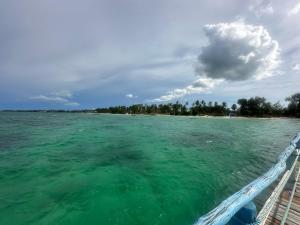 a view of the ocean from a boat in the water at Kiwengwa Bungalow Boutique Resort in Kiwengwa