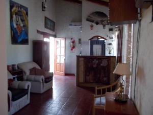a living room with a couch and a table at Divina Presencia in Cafayate
