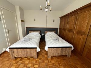 Postel nebo postele na pokoji v ubytování Vakantiehuis Santorini