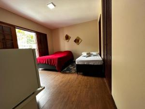 Ένα ή περισσότερα κρεβάτια σε δωμάτιο στο Village Hostel