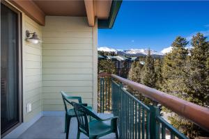 a balcony with two chairs and a view of the mountains at Trails End Easy Rest Condo: Ski In/Out, Stroll To Main Street in Breckenridge