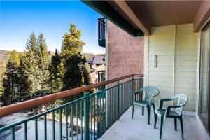 two chairs on a balcony with a view at Trails End Easy Rest Condo: Ski In/Out, Stroll To Main Street in Breckenridge