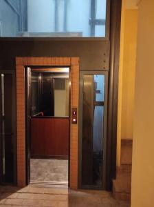 an entrance to an elevator in a building at Appartamento di lusso Corso d'Augusto Rimini in Rimini