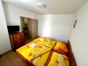 Postel nebo postele na pokoji v ubytování Hospůdka a Ubytování U Mitucha