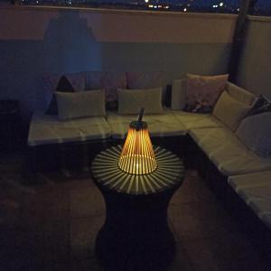 a lamp sitting on a table in a living room at La Colina Playa&Golf in Huelva