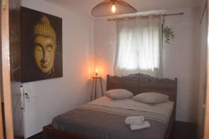 Postel nebo postele na pokoji v ubytování Superbe villa saint leu piscine et spa vue Océan