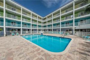 an image of the pool in front of a hotel at Pelican Point on Clearwater Beach in Clearwater Beach