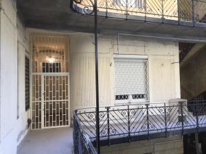 a balcony with a gate and a window at S6 - APARTMENT PROMO next to gozsdu garden in Budapest