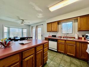 a kitchen with wooden cabinets and a counter top at Worley's House in Rockdale