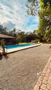 a swimming pool in the middle of a driveway at Sitio Bonanza in Guaratuba