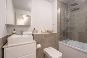 a bathroom with a sink and a toilet and a shower at Pass the Keys Liverpool Baltic Triangle Spacious Flat Sleeps 4 in Liverpool