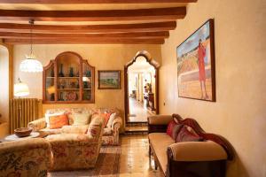 a living room with two couches and a table at Casa Victor Riu in Piera
