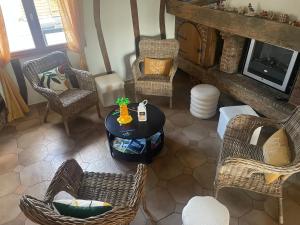 an overhead view of a living room with a table and chairs at Le Vrai Paradis in Estréboeuf