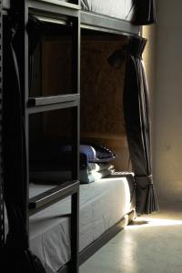 a bedroom with a bunk bed and a bed with a ladder at COOLFREEDIVING Hostel in Green Island