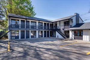 an empty parking lot in front of a building at The Local Motel & Shops in Eugene