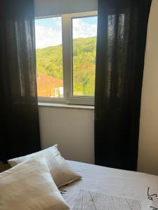 a bedroom with a bed and a window at RG MAISON - Room 35 in Morino