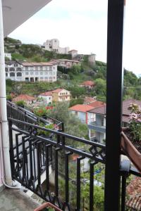 a balcony with a view of a city at DEAL Castle View Rooms in Krujë