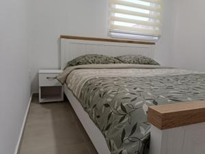 Postel nebo postele na pokoji v ubytování Apartman Spasić 2