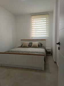 Postel nebo postele na pokoji v ubytování Apartman Spasić 2
