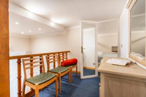 a small room with two chairs and a desk at Apartment Duomo in Florence