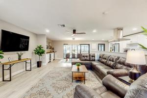 a living room with a couch and a table at Sunrise Bay Escape in Fort Myers Beach