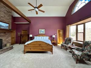 a bedroom with a bed and a ceiling fan at Warner-Concord Farms Bed & Breakfast in Geneva
