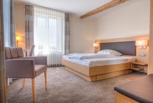 Postel nebo postele na pokoji v ubytování Gasthaus Blume