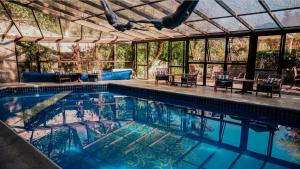A piscina localizada em Hotel Casa da Montanha ou nos arredores