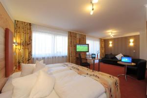 Postel nebo postele na pokoji v ubytování Hotel Pockinger Hof