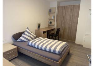 Postel nebo postele na pokoji v ubytování Kegelspiel Apartments