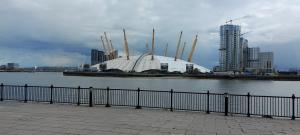 a large white building next to a body of water at Great for Break in London