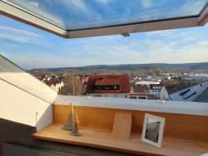 a balcony with a view of a city at auszeit34 in Ebelsbach