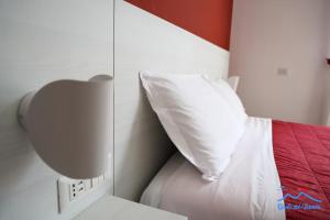 A bed or beds in a room at Quelli del vesuvio