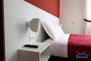 A bed or beds in a room at Quelli del vesuvio