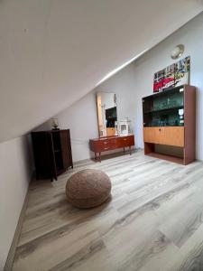 a living room with a television and a rug on the floor at Apartments Tudor Nikola in Hvar