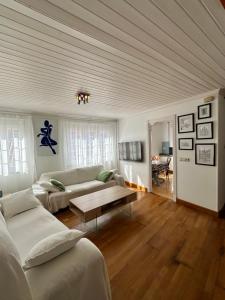 a living room with a couch and a table at Gran ático dúplex centro Muros,Terraza con vistas in Muros
