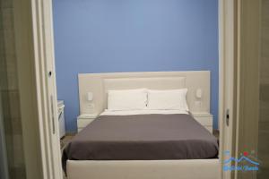 A bed or beds in a room at Quelli del vesuvio
