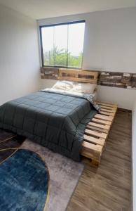 Postel nebo postele na pokoji v ubytování El Refugio de Luisinho