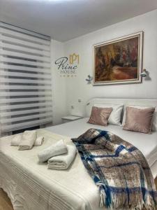 a bedroom with a large bed with a blanket on it at Princ house in Leskovac