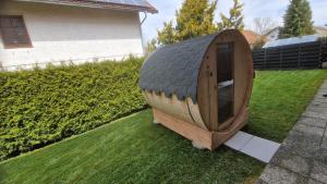 a wooden boat sitting on the grass in a yard at AMW Ferienwohnungen in Legau