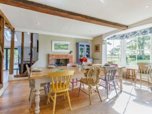 a kitchen and dining room with a table and chairs at 3 Bed in Saffron Walden 85662 in Finchingfield