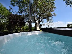 a pool of water with trees in the background at 3 Bed in Saffron Walden 85662 in Finchingfield