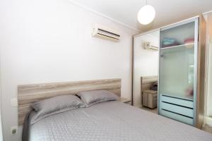 Krevet ili kreveti u jedinici u objektu 371 - Apartamento 3 dormitórios na praia de Bombas