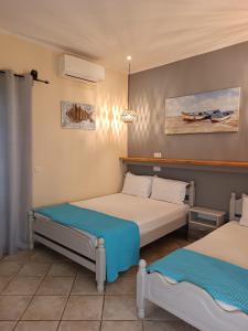 a bedroom with two beds at Ilios studios in Vasiliki