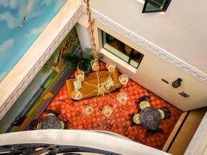 an overhead view of a table and chairs in a building at Hotel Castilla Real in Pereira