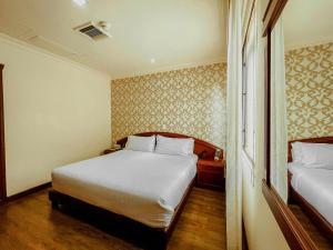 Postel nebo postele na pokoji v ubytování Hotel Castilla Real + 37 fotografií