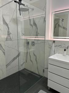 a bathroom with a shower and a sink at New and modern flat between Potsdamer Platz and Tiergarten in Berlin