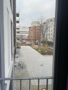 a view of a street from a window at New and modern flat between Potsdamer Platz and Tiergarten in Berlin